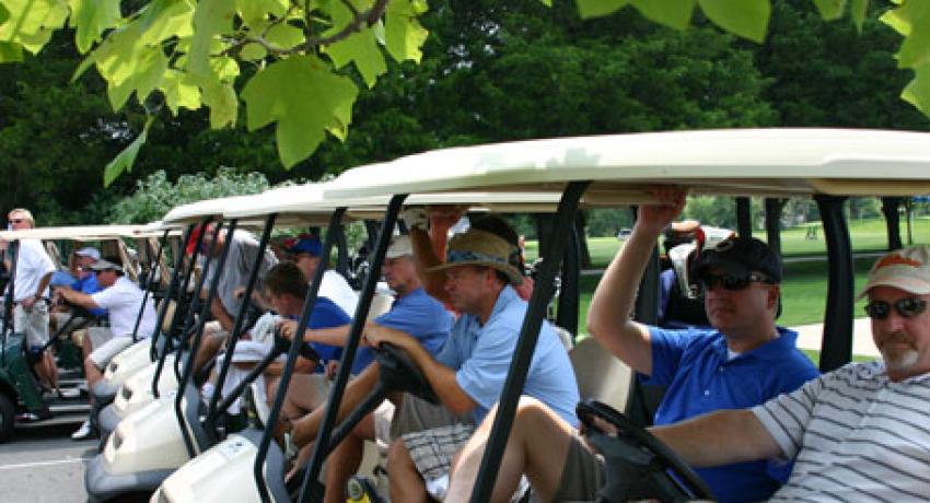 participants sitting in golf carts