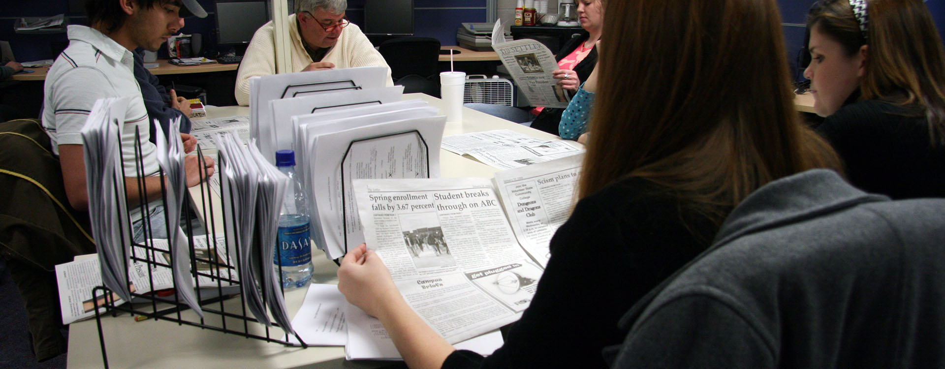 students working in the Settler newspaper office