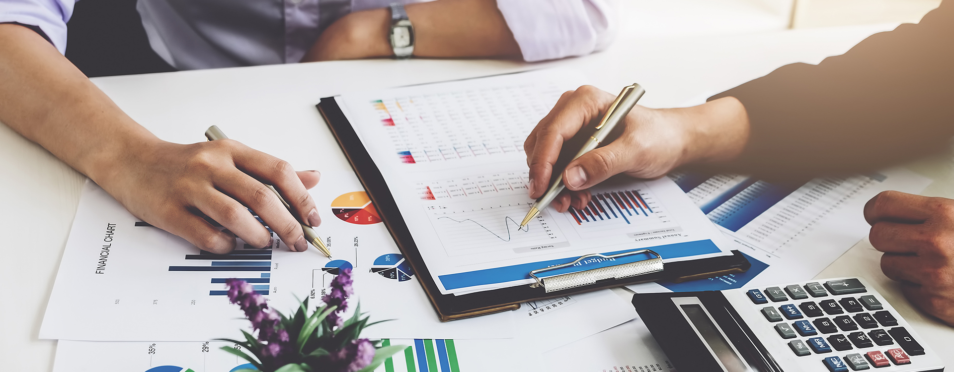 two business professionals crunching the numbers