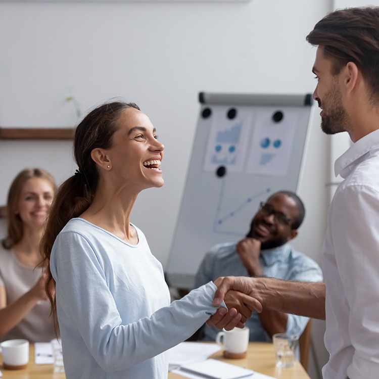 student handshaking with the professor