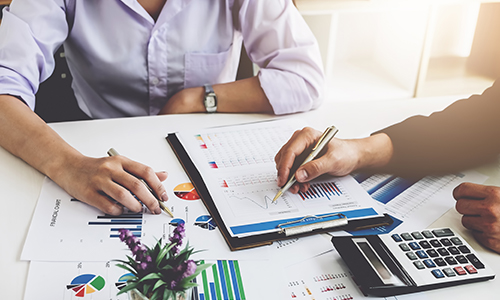 business professionals looking over finances