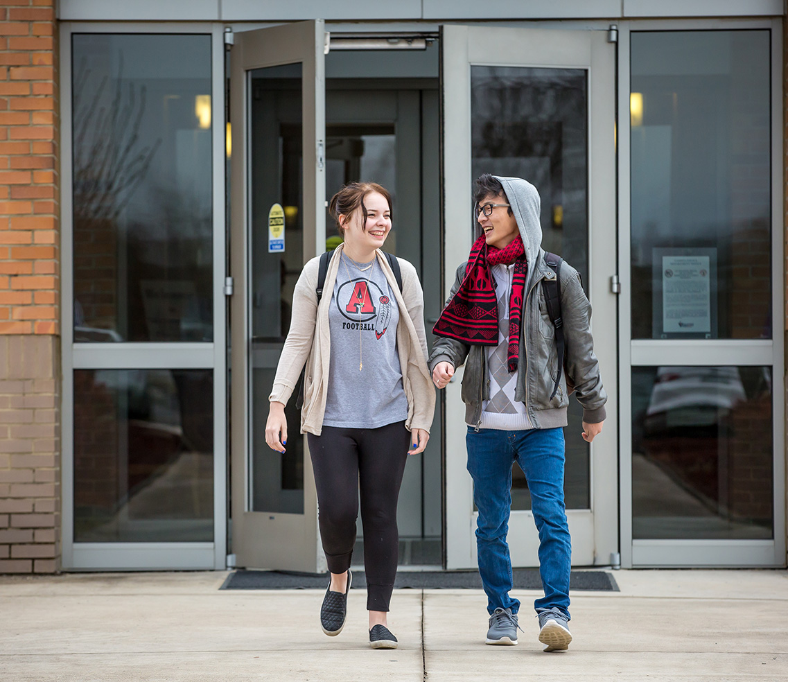 two students departing the Livingston Center