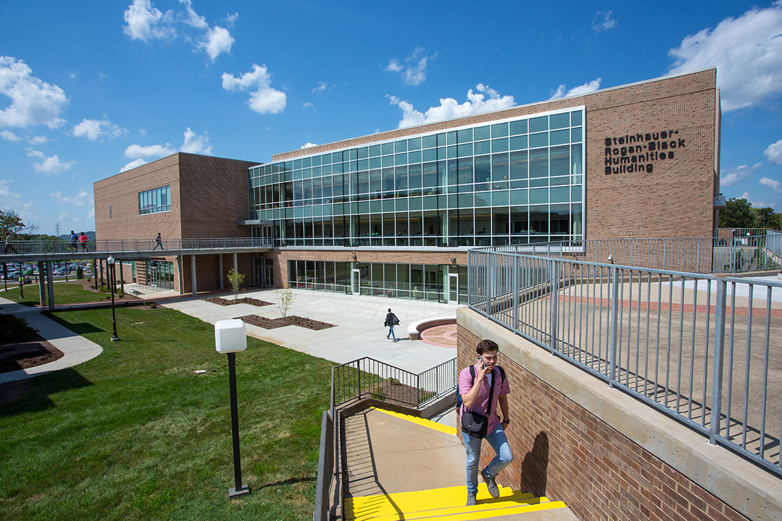 a few students outside the Steinhauer-Rogan-Black Humanities Building on the Gallatin Campus