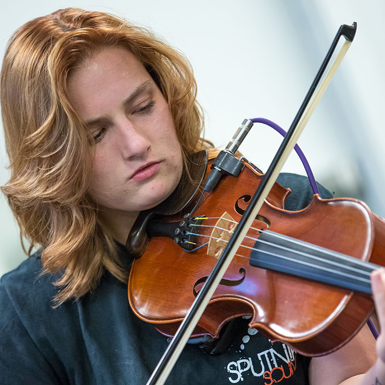 student playing the violin