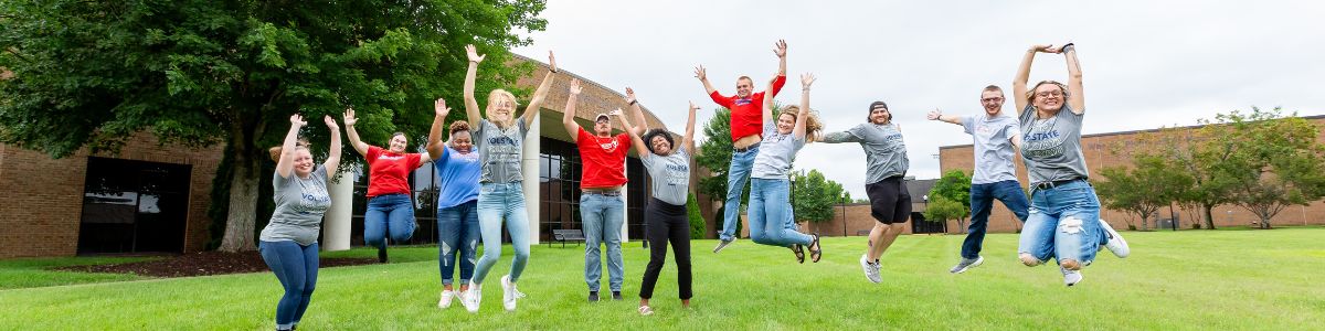 vol state students jumping in the air