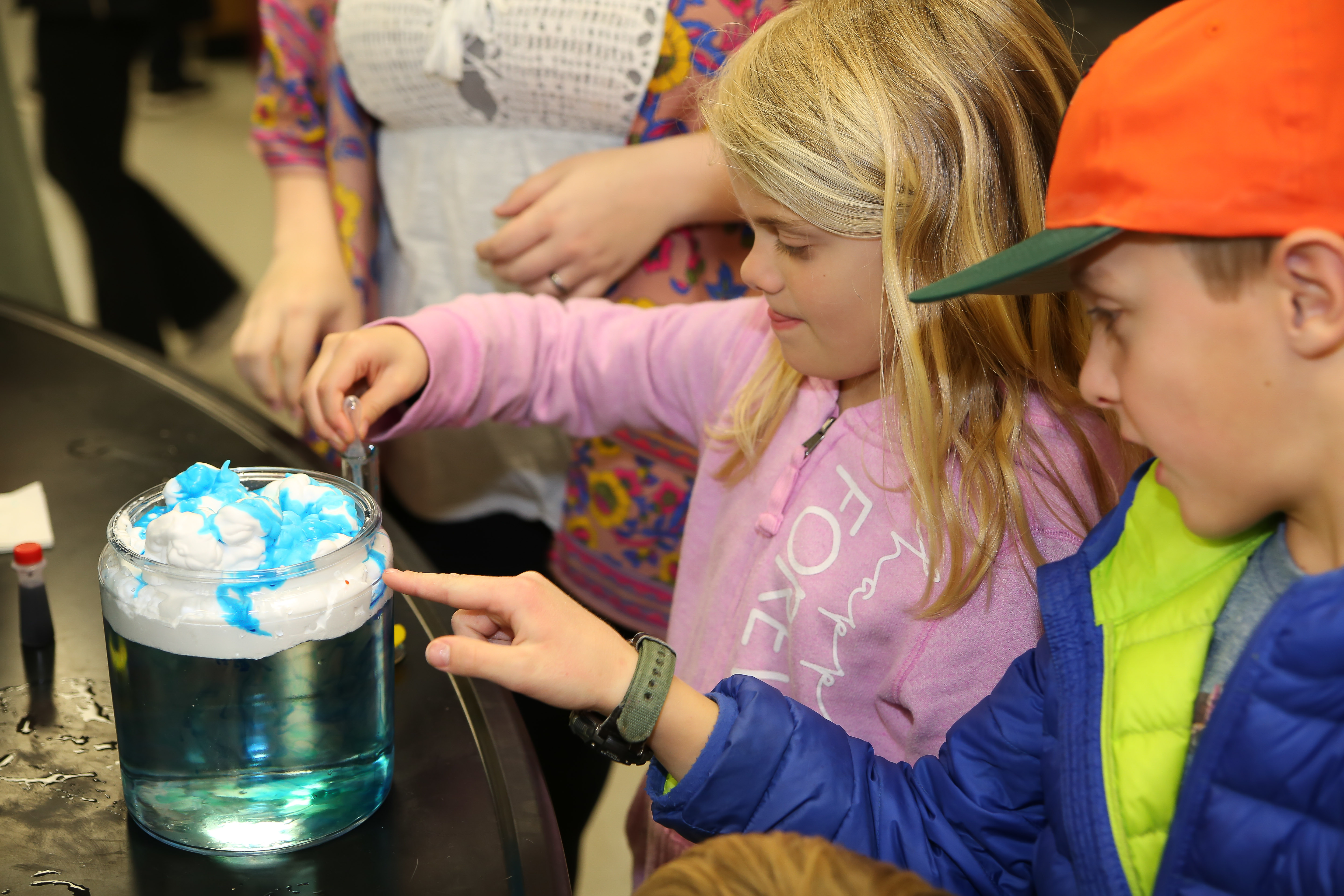 children participating in a science experiment
