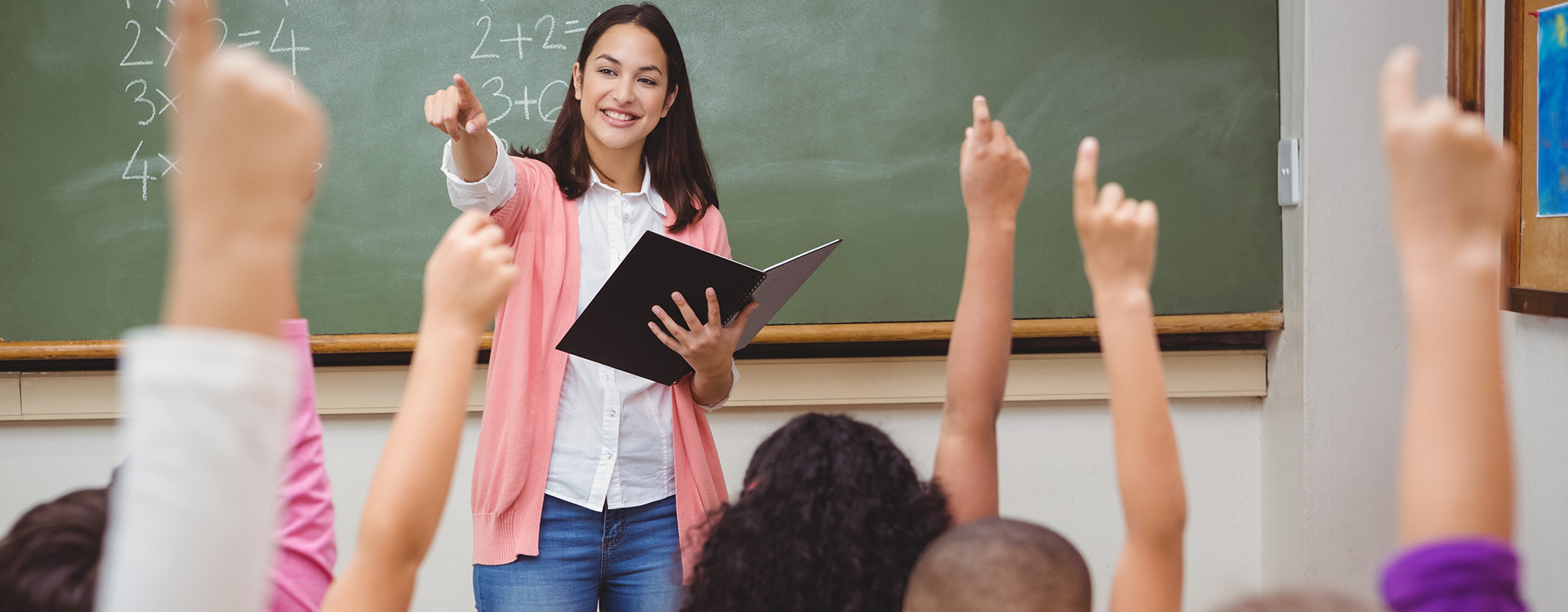 teacher working with children in a classroom