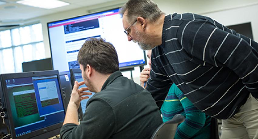 teacher and student in the computer lab