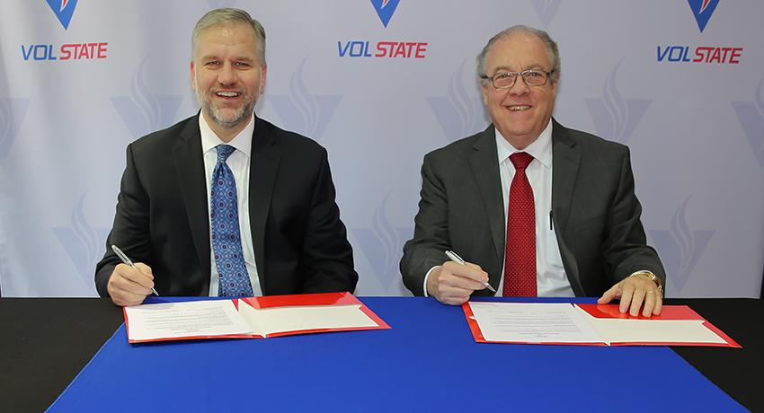 Welch College president, J. Matthew Pinson and Vol State president, Jerry Faulkner, sign the transfer agreement in Gallatin.