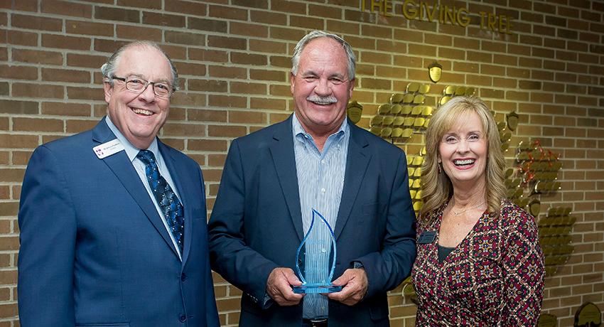 Vol State president, Jerry Faulkner, congratulates Bill Sinks, along with Karen Mitchell, executive director of the Volunteer State College Foundation.