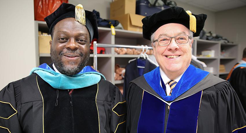 Kenyatta Lovett, gave the commencement address, shown here with Jerry Faulkner, Vol State president.