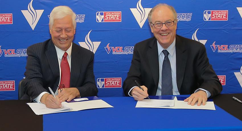 Dr. Faulkner and Dr. Fisher sign new Business program partnership