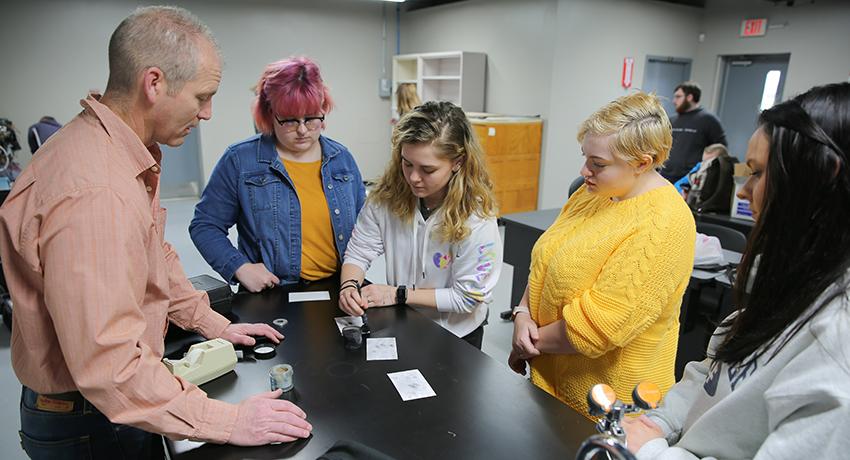 Vol State instructor Frank Ragains demonstrates fingerprinting techniques. Students left to right: Mick Fairchild of Hendersonville; Abby Smith of Smith County; Caitlyn Cook of Portland; and Hannah King of Mt. Juliet. 