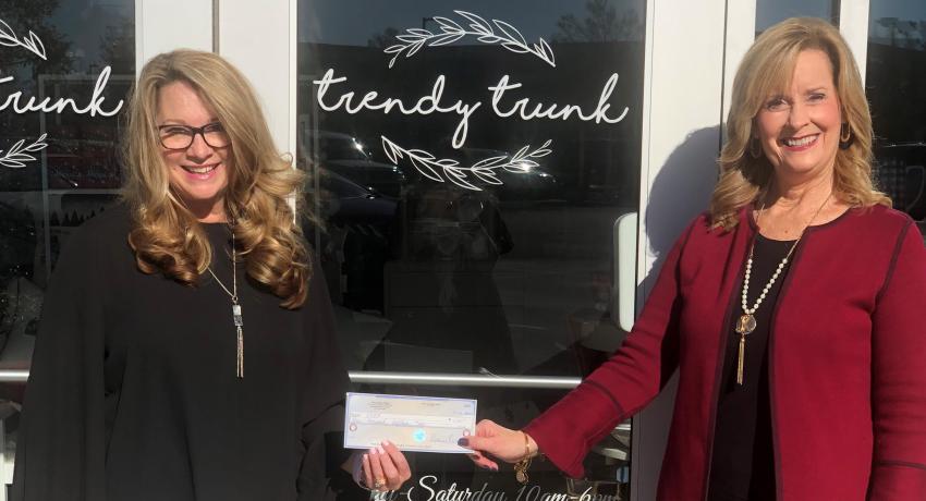 Deanna Williams, the owner of the store said: “It is important to me, especially this year, to help a student who wouldn’t have otherwise been able to afford tuition or books.” She is shown here (left) with Karen Mitchell (right), executive director of the College Foundation. 