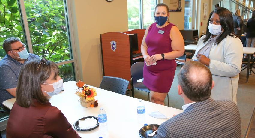 president of Volunteer State Community College, Orinthia Montague (top right), met with school officials and others during an open house on Thursday. It was also an opportunity to introduce the community to the new Vol State at Springfield site director, Destinee Duff (top left)