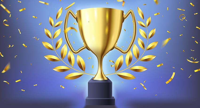 Gold cup with gold celebration ribbon in the air