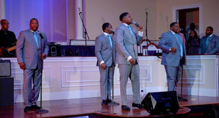 Isaiah Perry performing with the choir at a church