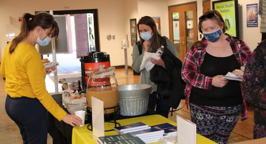 attendees looking over the different displays at the event