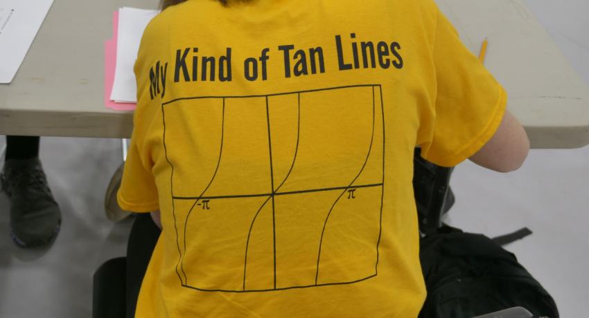 image of a funny, yellow shirt with the words "My Kind of Tan Lines" and a mathematics graph with tan lines