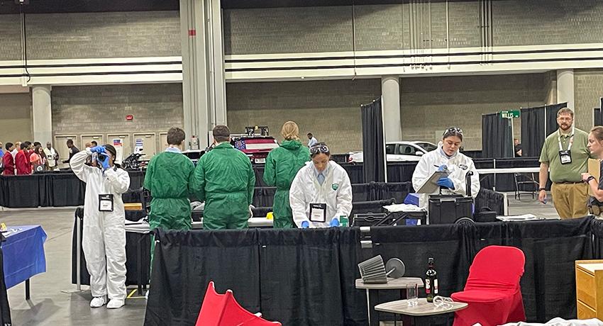 Students Nicole Fowler, Jasmine Harrison, Sarai Edwards working their event