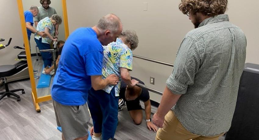 therapist helping a MS patient