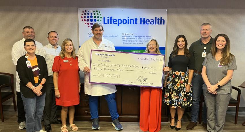 Rod Harkleroad, CEO of Highpoint Health Sumner with Ascension Saint Thomas, presenting a check with Dr. Wendi Tostenson, President of Volunteer State Community College, along with representatives from both organizations