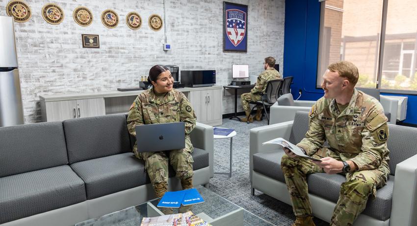 three military students enjoying the new Dr. Orinthia T. Montague Veterans and Military Family Center