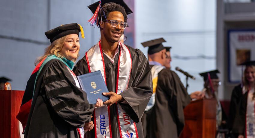Graduate receiving his diploma from Vol State President Dr. Tostenson