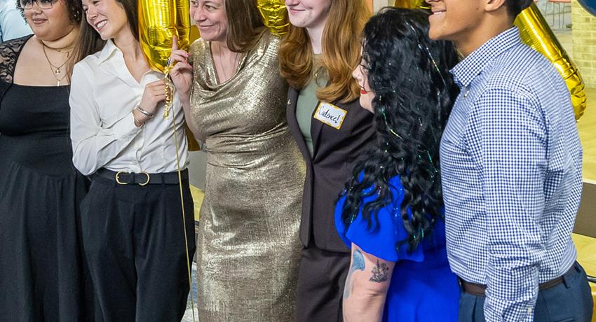 students in front of the PTK balloons