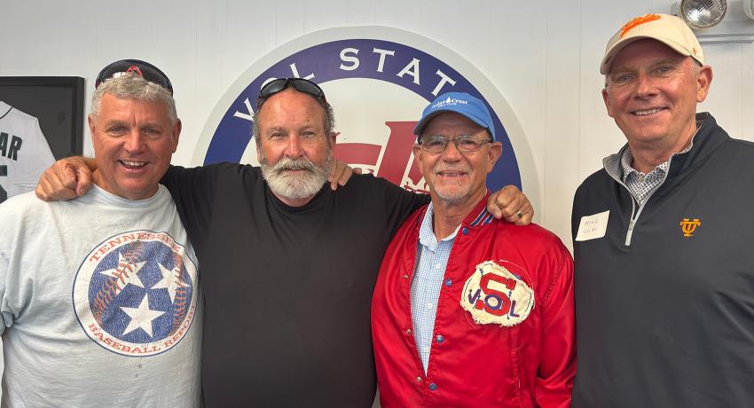 four baseball alums enjoying reuniting with each other