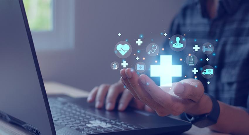 health information manager working on a laptop