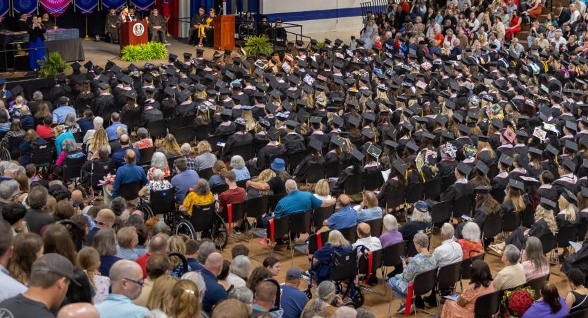 a view of the crowd and graduates at the Spring 2026 Commencement