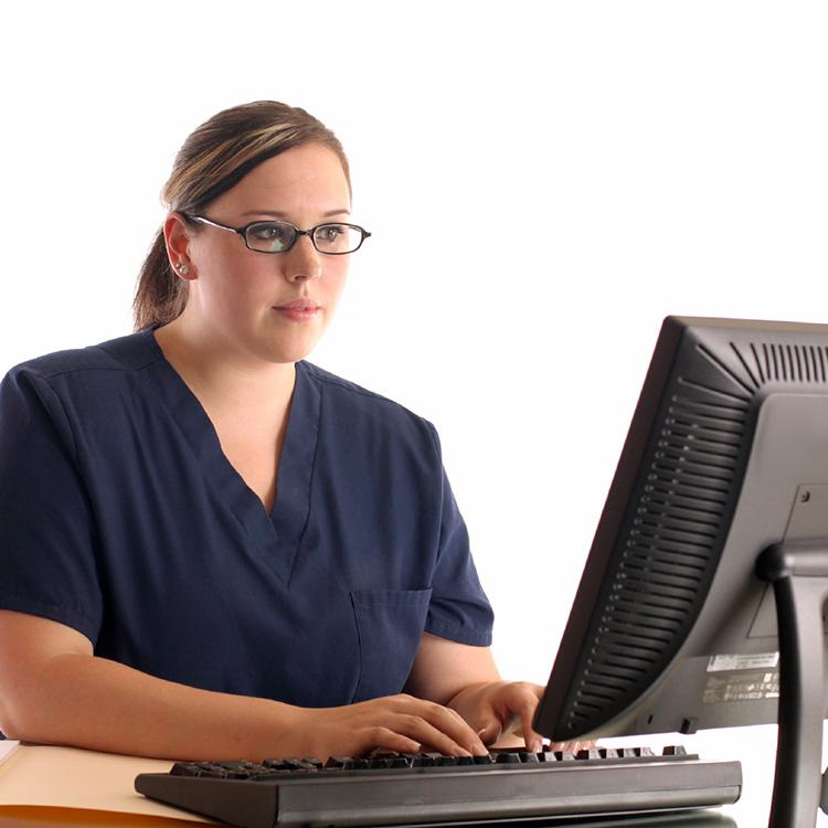 medical assistant at a computer