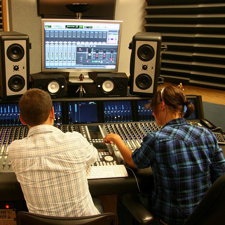 students working in a recording studio