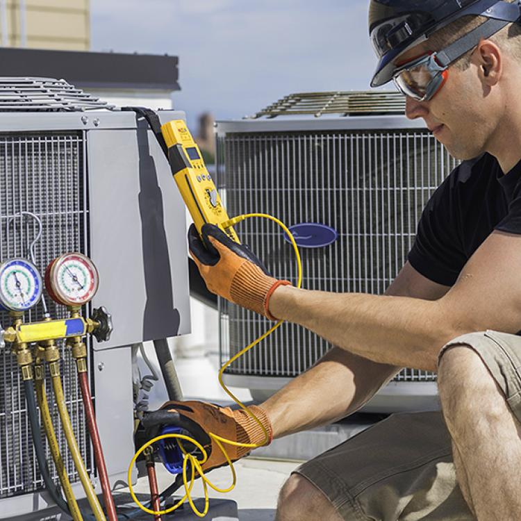 HVAC/R Technician checking the HVAC equipment