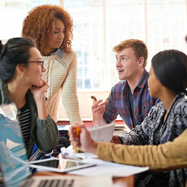 an adult mentoring students